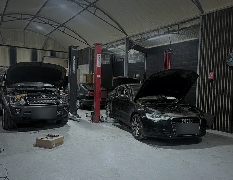 Cars on two-post lifts during servicing at the Alan Dawson Autoworks workshop in Navan